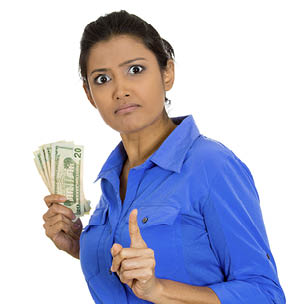Closeup portrait of greedy young woman corporate business employee, worker, student holding dollar banknotes tightly, isolated on white background  Negative human emotion facial expression feeling