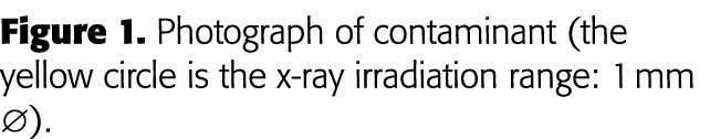 Figure 1  Photograph of contaminant (the yellow circle is the x-ray irradiation range: 1 mm Æ) 
