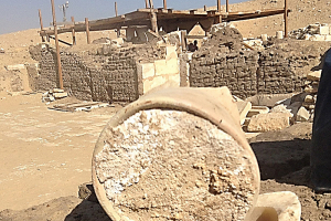 Photo of the old cheese in its container at the excavation site in Egypt.