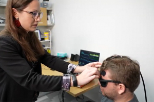 Photo of the ICP sensor being placed on a forehead