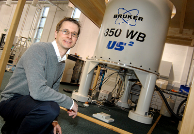 Professor Steven Brown at the NMR facility. Credit University of Warwick Photo of Steven Brown with NMR spectrometer