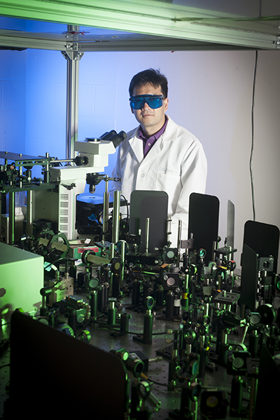 Ji-Xin Cheng leads a Purdue team demonstrating a new imaging technology developed with a $1 million W.M. Keck Foundation grant. The technology could bring advanced medical diagnostics. (Vincent Walter/Purdue University image) Photo of J-Xin Cheng in his lab. (Vincent Walter/Purdue University image)