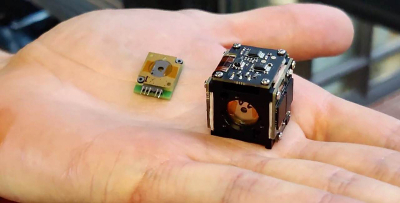 A first-generation compact hyperspectral camera designed by VTT and the Fabry–Perot interferometer used in it. (Photo: Leevi Annala)