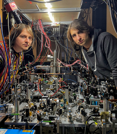 Left: Mateusz Mazelanik, the manager of the Quantum Optical Devices Laboratory, and Dr Michał Parniak next to the quantum-memory-based processor for light. Credit: Centre for Quantum Optical Technologies, University of Warsaw