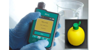 Photo of the MIRA DS spectrometer and a squeeze bottle