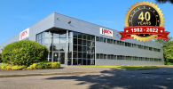 Photo of Hiden's factory with the 40th anniversary logo overlayed