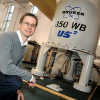 Photo of Steven Brown with NMR spectrometer