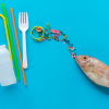 Photo of sources of microplastics and a fish on a blue background