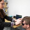 Photo of the ICP sensor being placed on a forehead